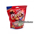 Delicious chocolate cups with biscuit in bag 